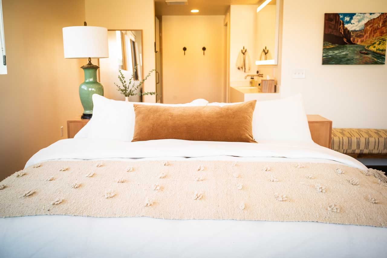 Cozy bedroom with stylish decor and soft lighting.