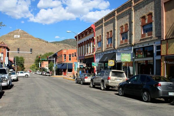Historic small-town main street with mountain backdrop