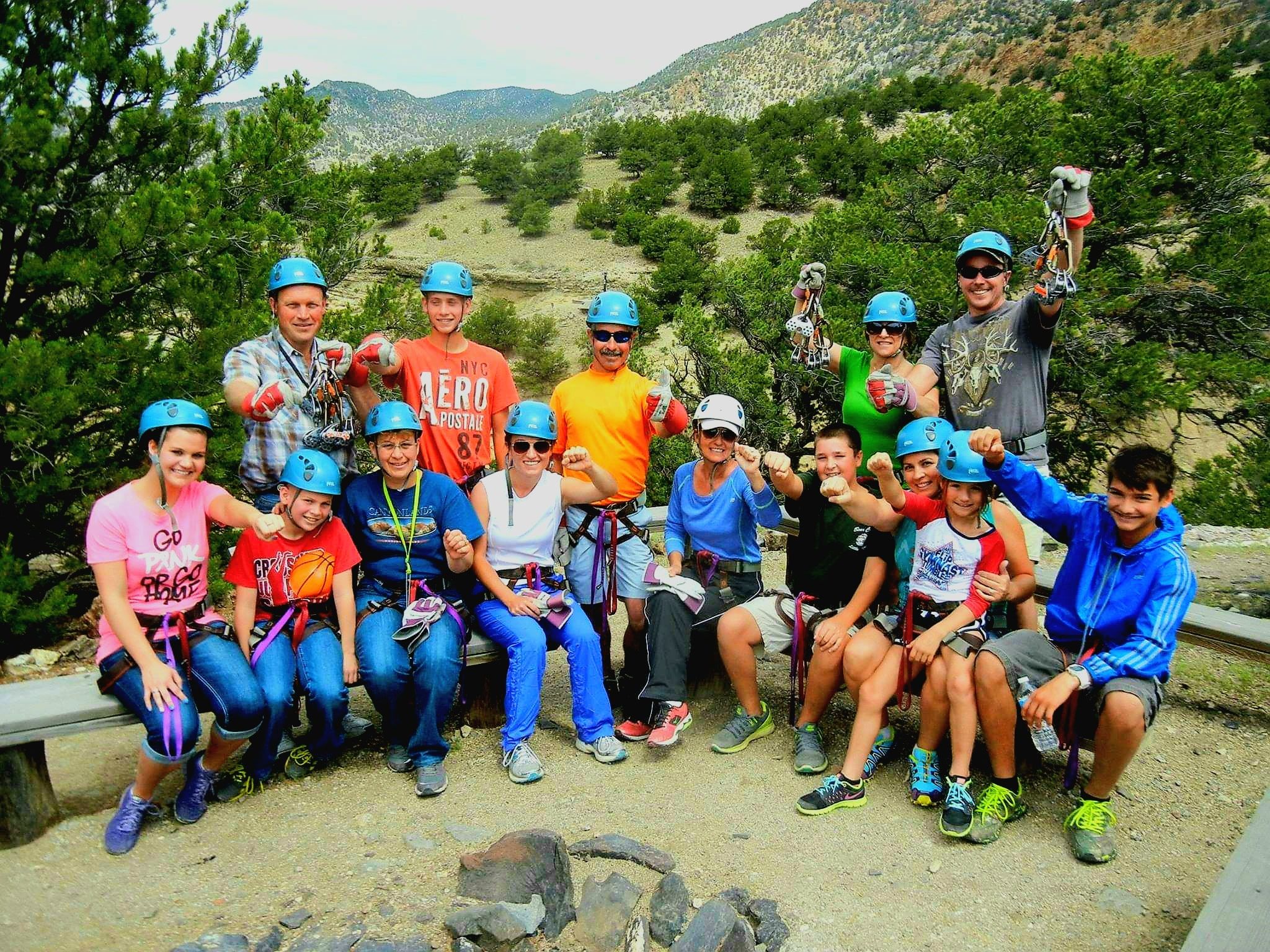 Group wearing helmets and harnesses in mountains