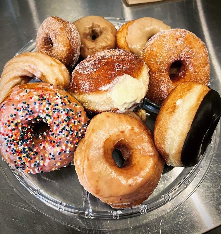 A Bowl of Doughnuts with different toppings