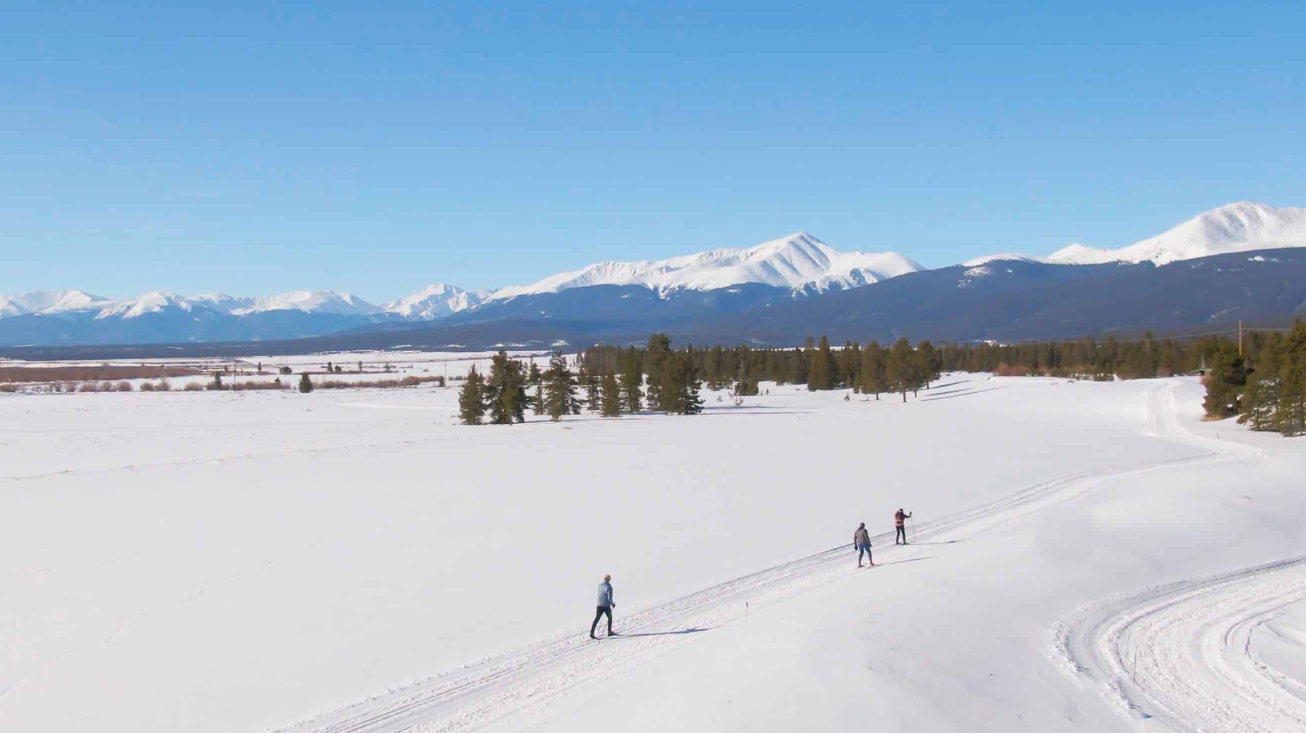 Cross-country skiers on snowy mountain landscape