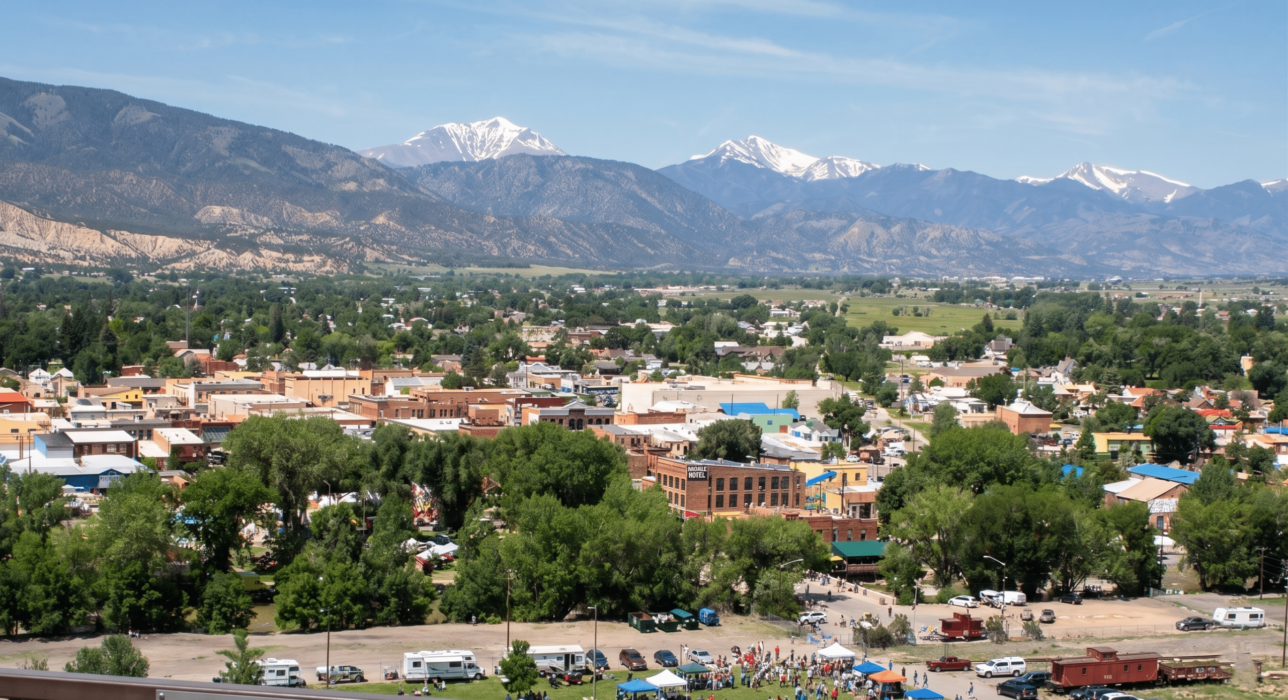 Small town with mountains and snow-capped peaks