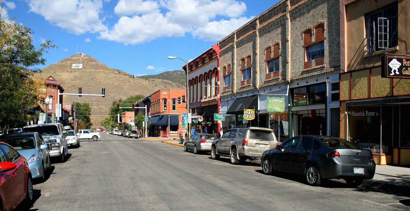 Historic small-town main street with mountain backdrop