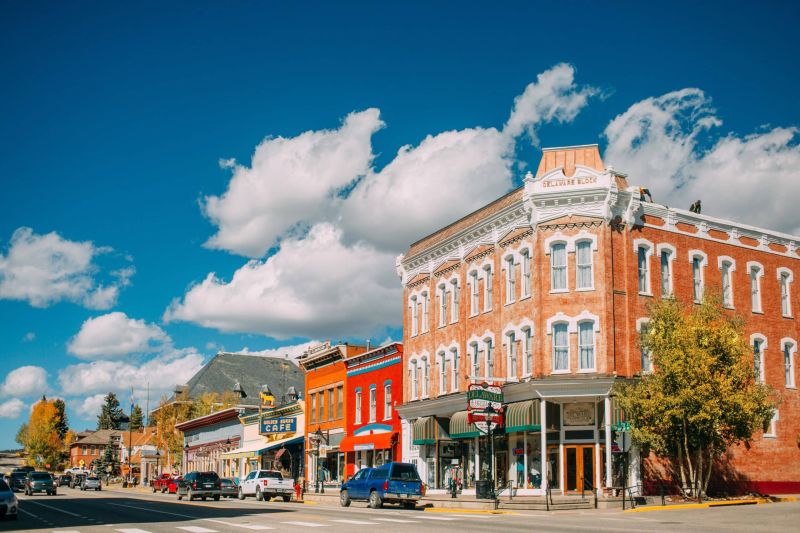 Historic brick buildings along sunny small-town main street