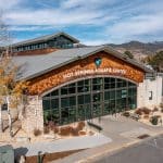 Hot Springs Aquatic Center exterior with mountain backdrop