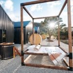 Modern cabins with outdoor canopy bed and sauna