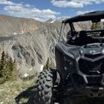 Off-road UTV overlooking rugged mountain landscape