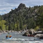 Whitewater rafters on rocky mountain river
